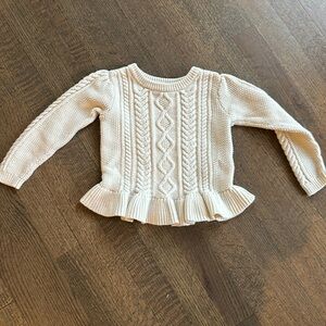 Cable knit ruffle peplum sweater
